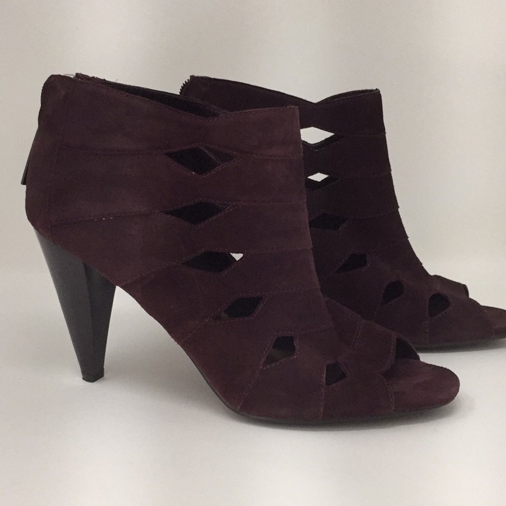Report plum colored heeled sandles.  Suede like.